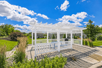 Crossroads at elm creek pergola-covered grilling & seating area
